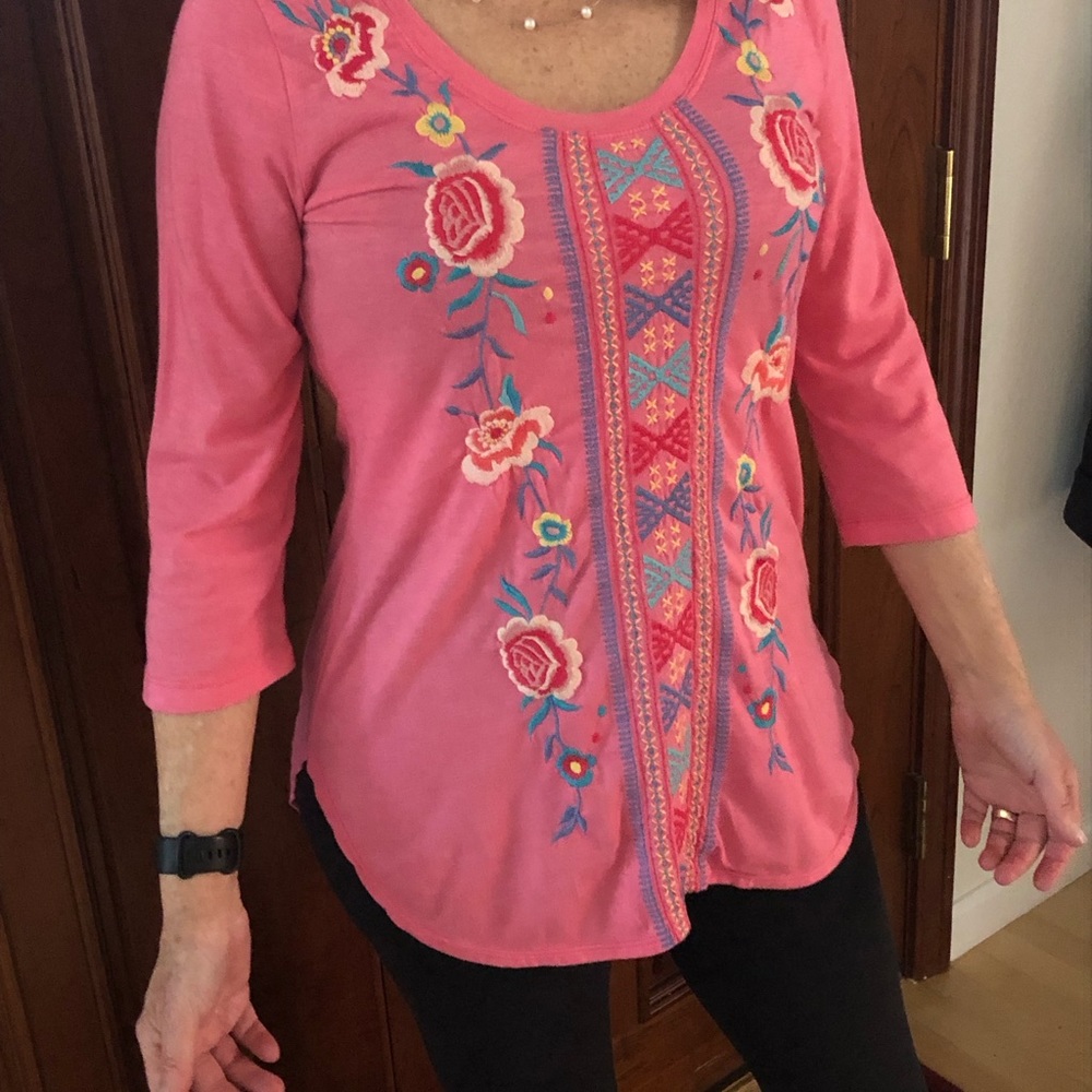 Johnny was pink/apricot tunic top.